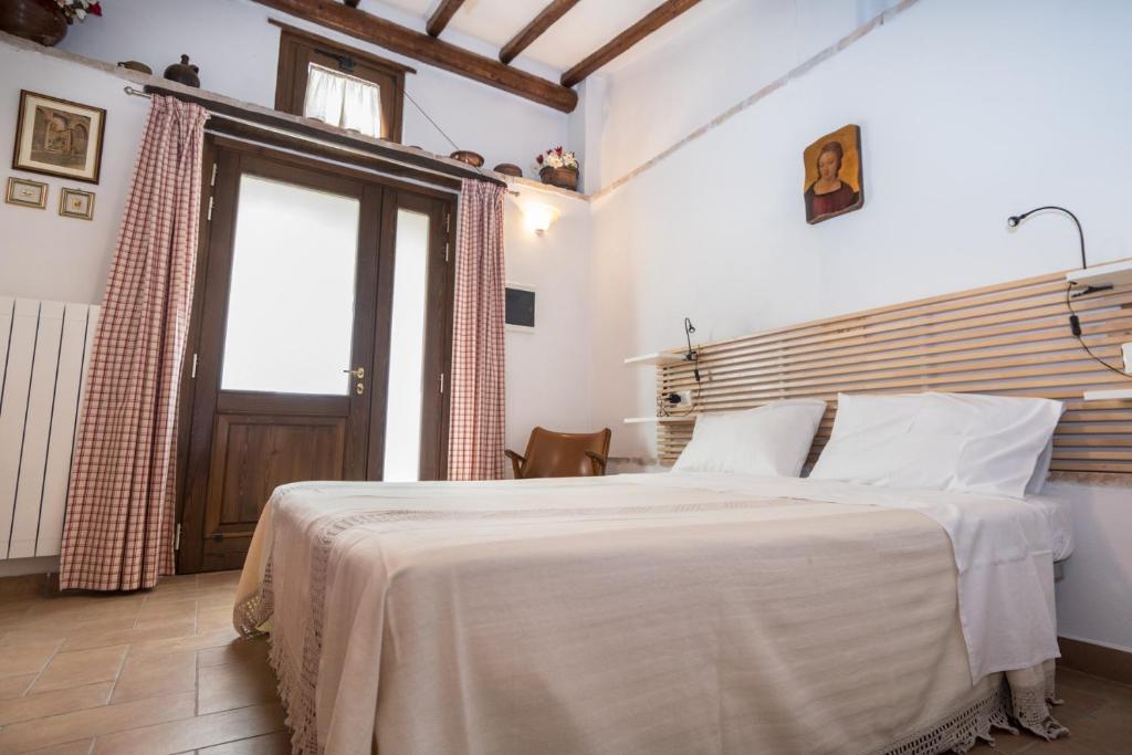 Postel nebo postele na pokoji v ubytování B&B Cantico Delle Creature