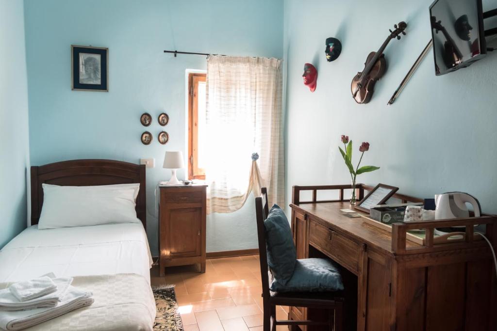 Postel nebo postele na pokoji v ubytování B&B Cantico Delle Creature