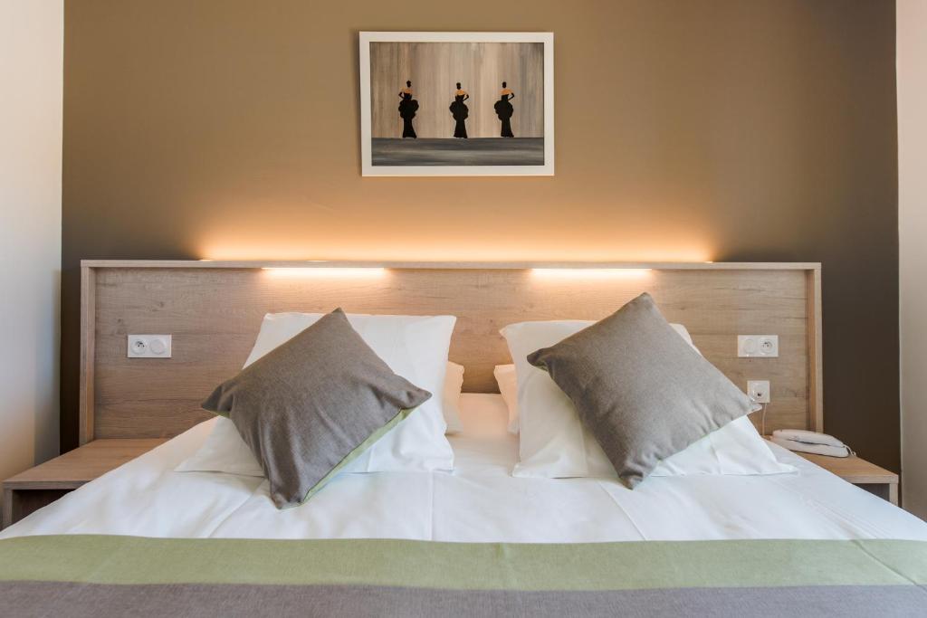Postel nebo postele na pokoji v ubytování Hotel du Grand Parc