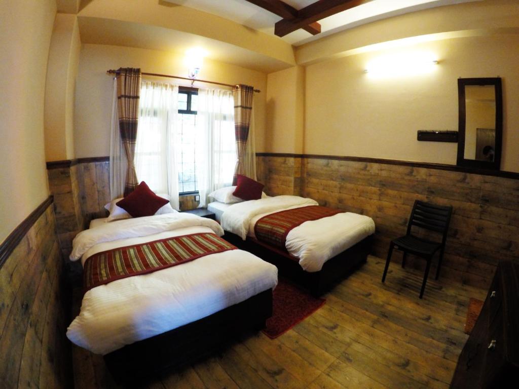 A bed or beds in a room at Hotel Forest Lake Backpackers' Hostel