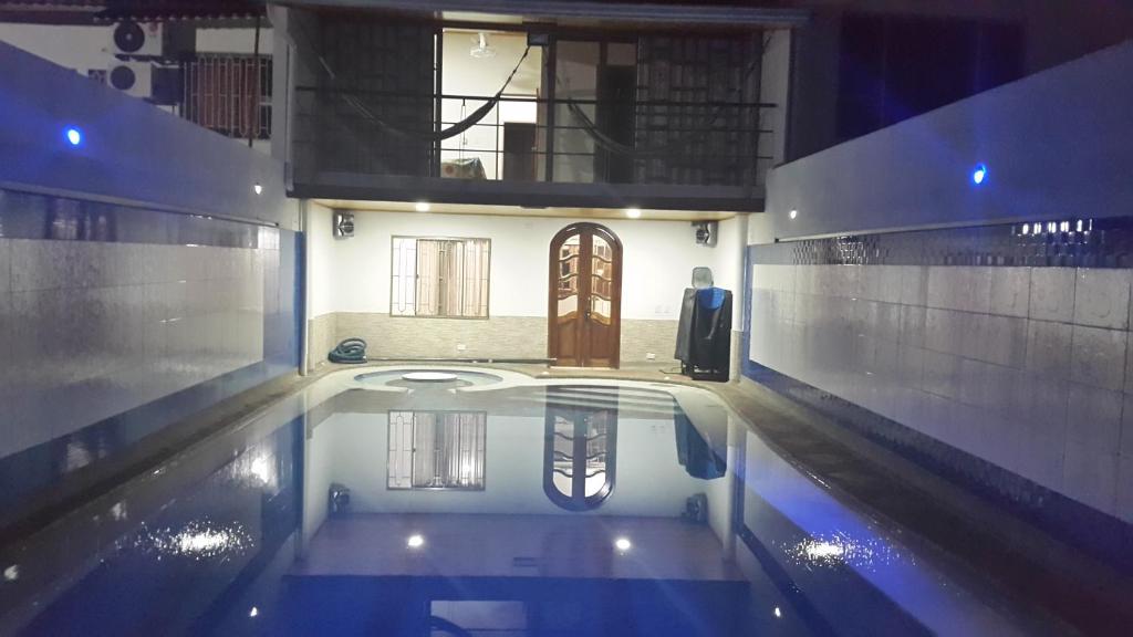 a house with a swimming pool in the middle at Casa con Piscina Privada y Jacuzzi in Flandes