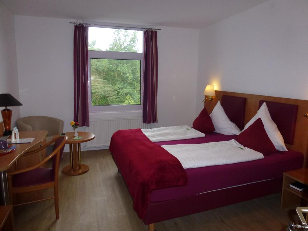 Postel nebo postele na pokoji v ubytování Hotel Wildunger Hof mit Gemeinschaftsküche