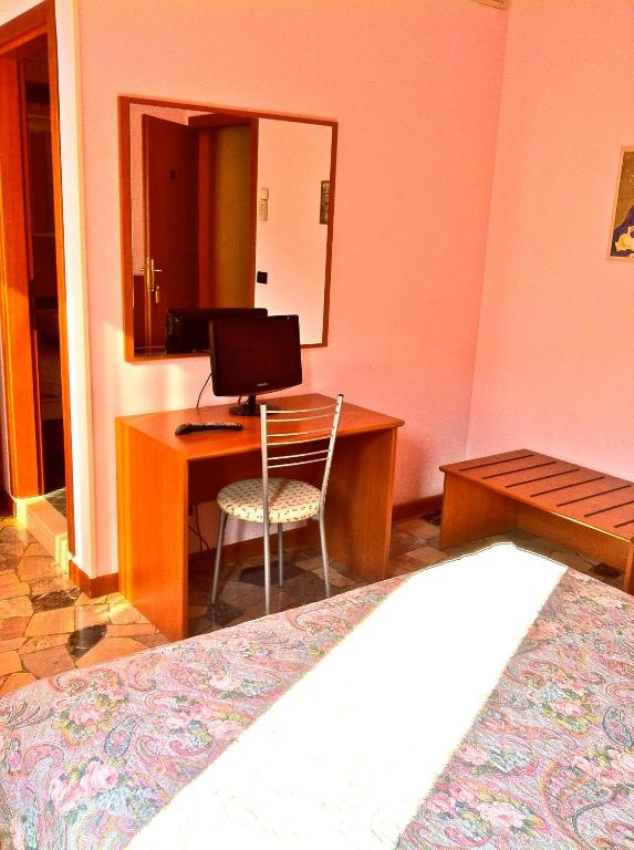 Postel nebo postele na pokoji v ubytování Albergo Isetta
