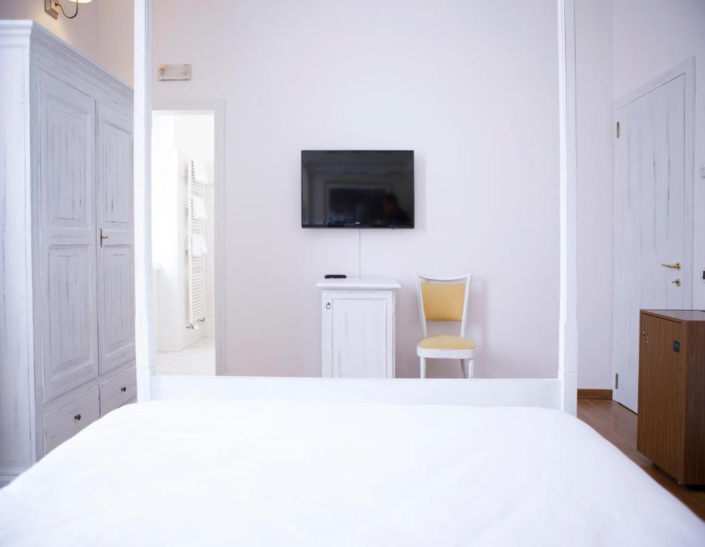 Postel nebo postele na pokoji v ubytování Hotel Sebino