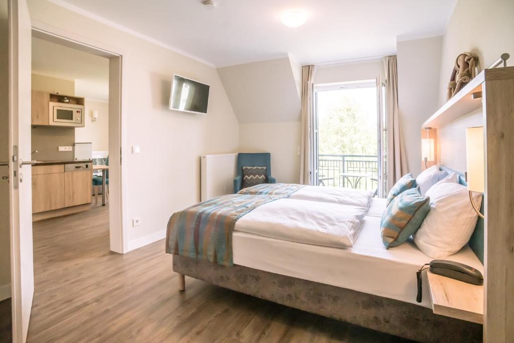 Postel nebo postele na pokoji v ubytování AKZENT Apartmenthotel Residenz