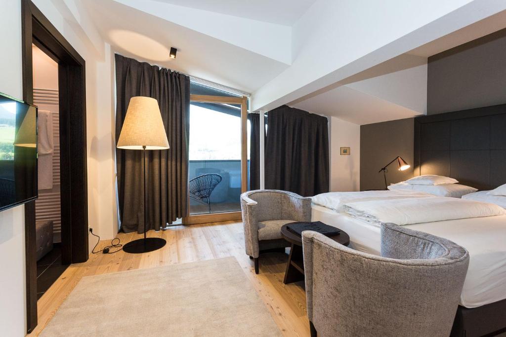 Postel nebo postele na pokoji v ubytování Hotel MAYR