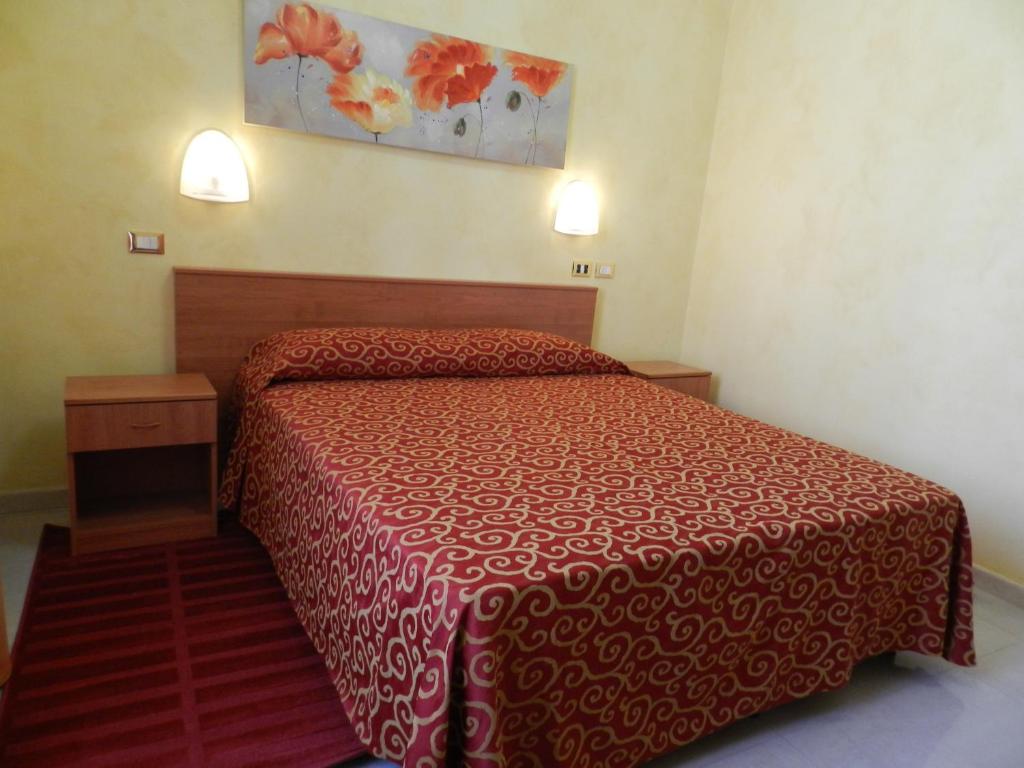 A bed or beds in a room at Hotel Air Palace Lingotto