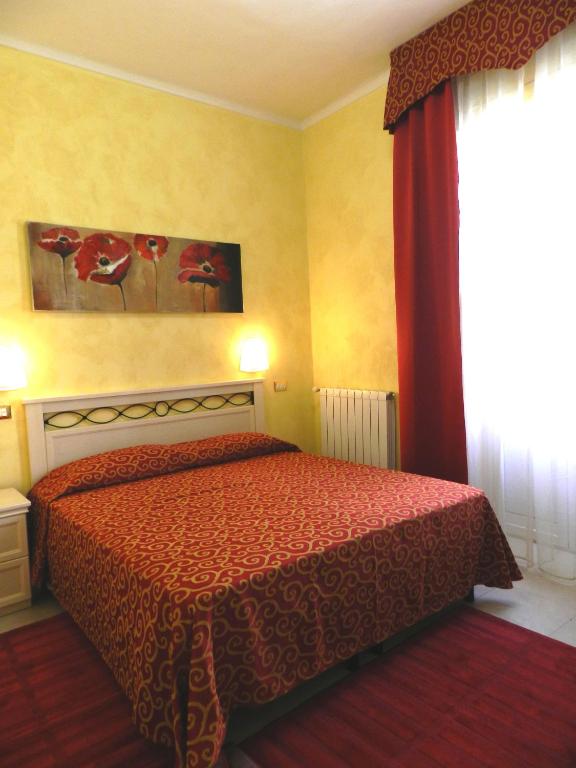 A bed or beds in a room at Hotel Air Palace Lingotto
