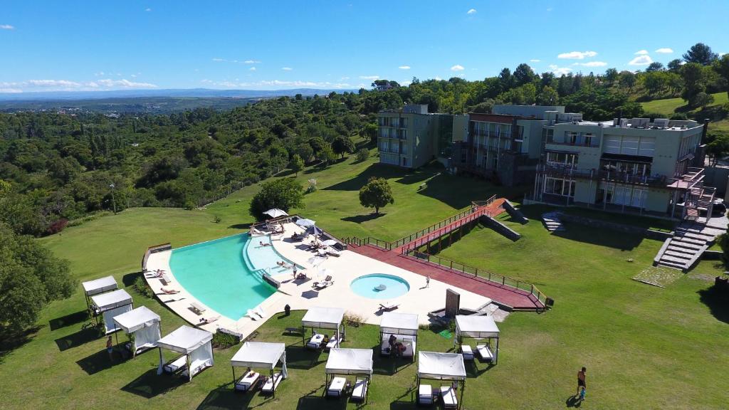 an aerial view of a resort with a swimming pool at Tres Pircas Hotel & Spa in Huerta Grande