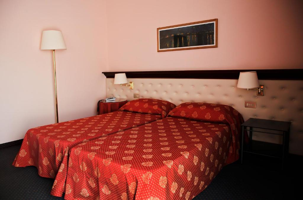 Postel nebo postele na pokoji v ubytování Hotel Torretta