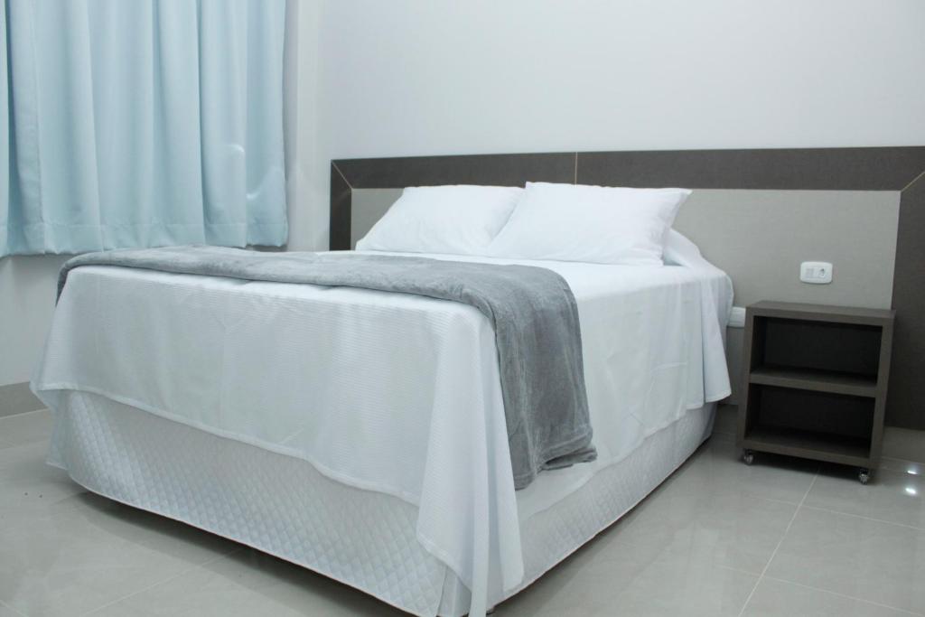 Postel nebo postele na pokoji v ubytování Hotel Cadori
