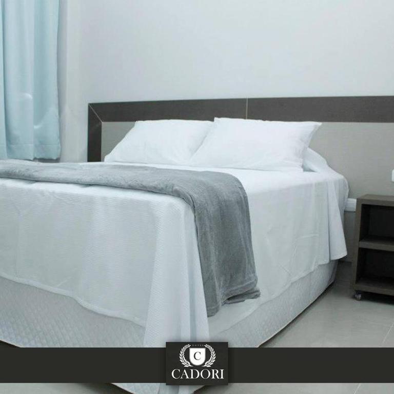 Postel nebo postele na pokoji v ubytování Hotel Cadori