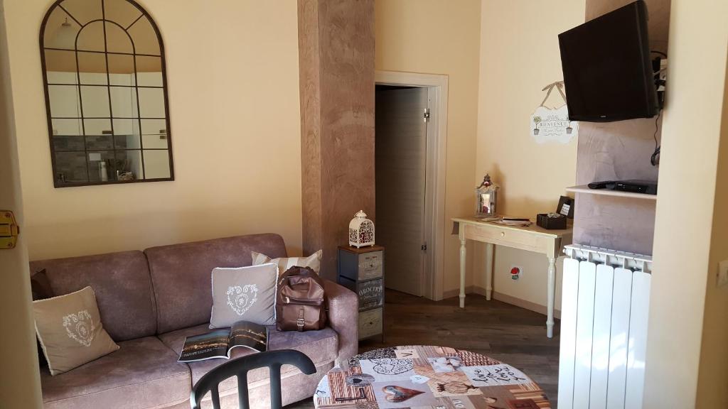 Televízia a/alebo spoločenská miestnosť v ubytovaní Piazza Signoria Suite