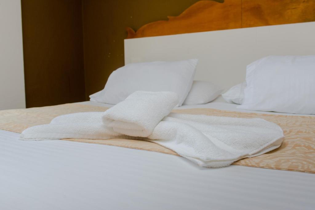Postel nebo postele na pokoji v ubytování Cartagena Royal Hotel Boutique