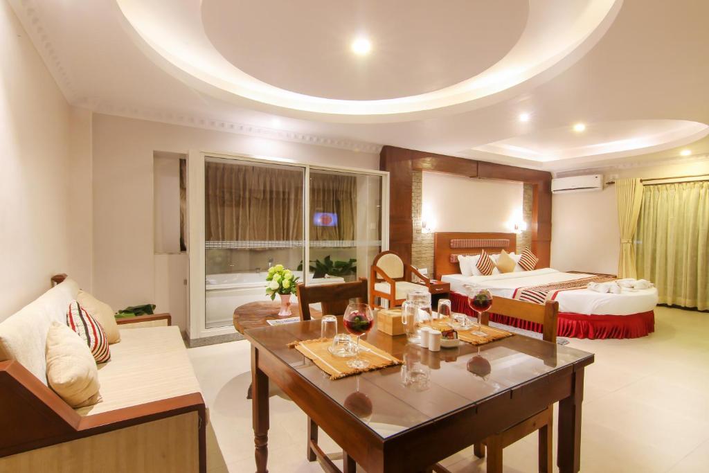 Voodi või voodid majutusasutuse Kuti Resort & Spa toas