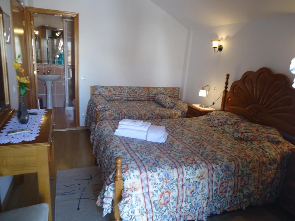 Postel nebo postele na pokoji v ubytování Hotel Aviz