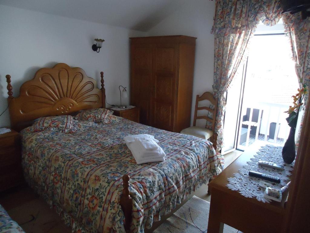 Postel nebo postele na pokoji v ubytování Hotel Aviz