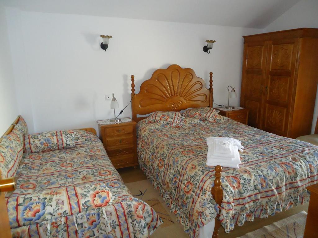 Postel nebo postele na pokoji v ubytování Hotel Aviz