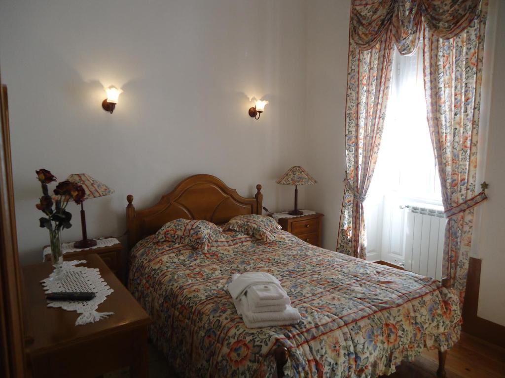 Postel nebo postele na pokoji v ubytování Hotel Aviz
