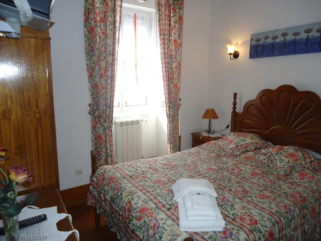 Postel nebo postele na pokoji v ubytování Hotel Aviz
