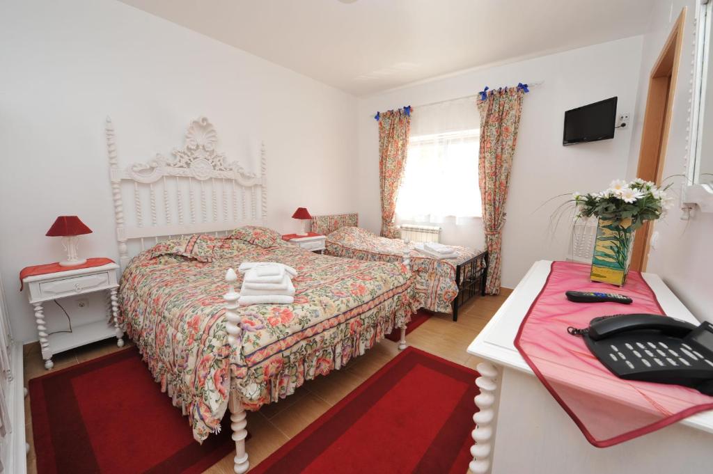 Postel nebo postele na pokoji v ubytování Hotel Aviz