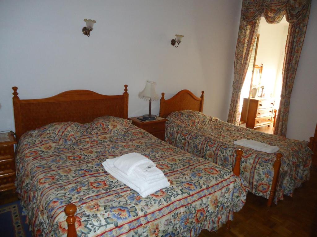 Postel nebo postele na pokoji v ubytování Hotel Aviz