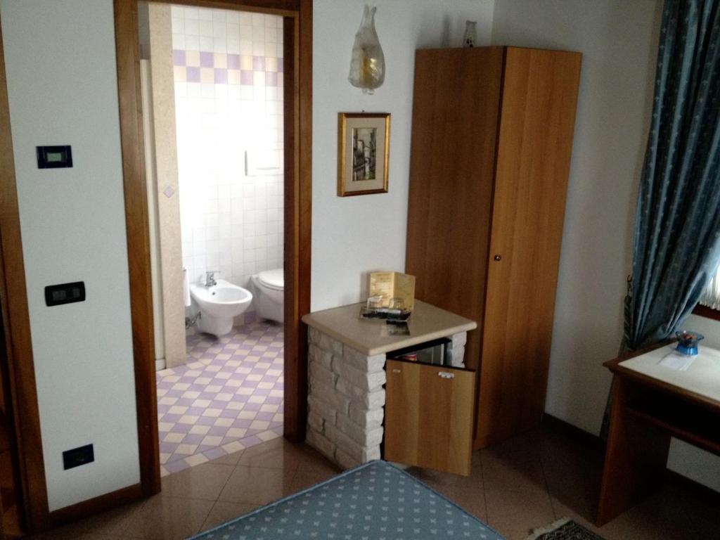 Postel nebo postele na pokoji v ubytování Ca'Nova Alloggi