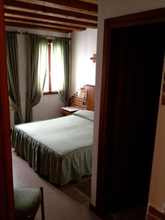 Postel nebo postele na pokoji v ubytování Ca'Nova Alloggi