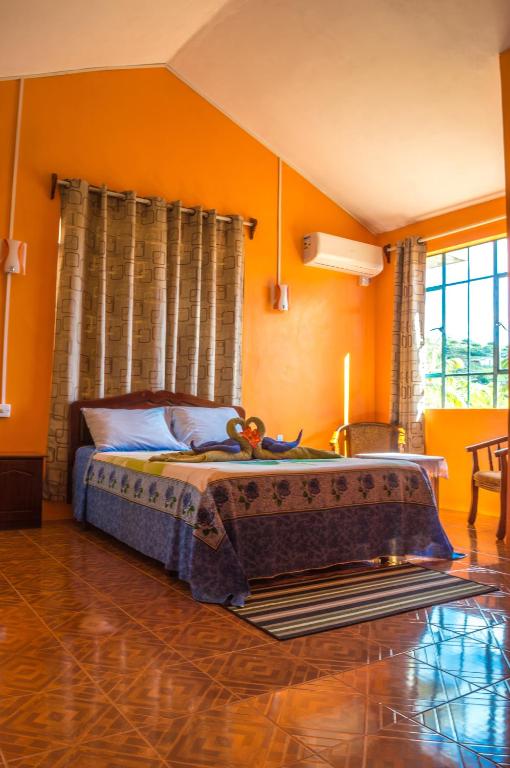 Postel nebo postele na pokoji v ubytování Merlin Guest House