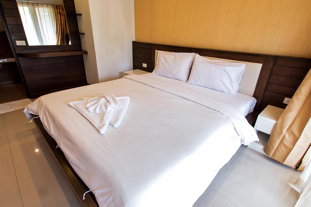 Postel nebo postele na pokoji v ubytování V Condominium Samui