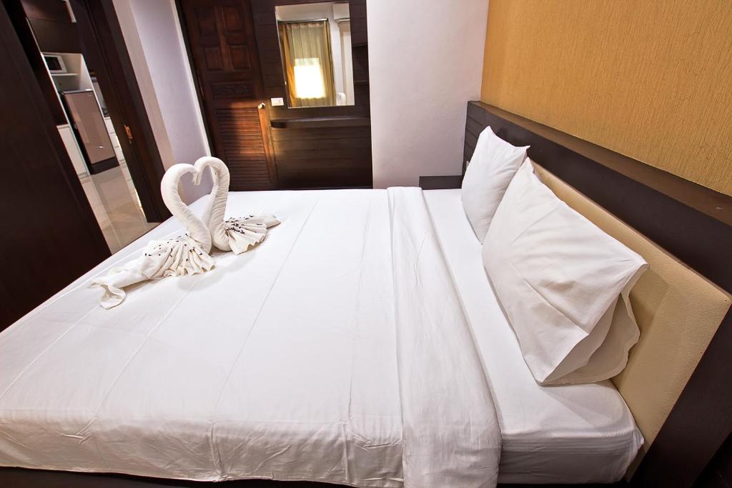 Postel nebo postele na pokoji v ubytování V Condominium Samui