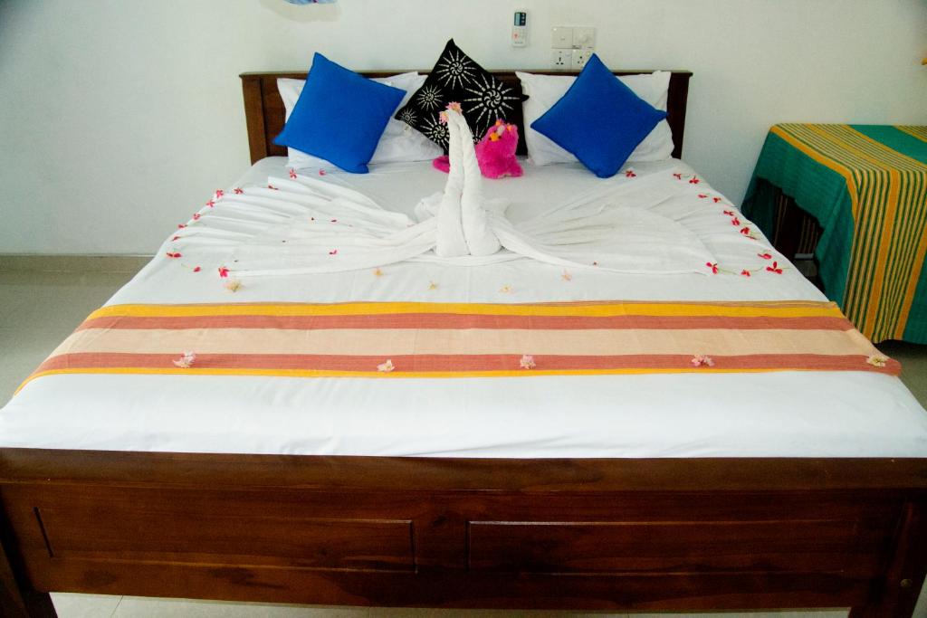 Postel nebo postele na pokoji v ubytování Freedom Home Stay