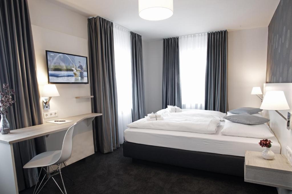 Postel nebo postele na pokoji v ubytování Hotel Alter Wirth