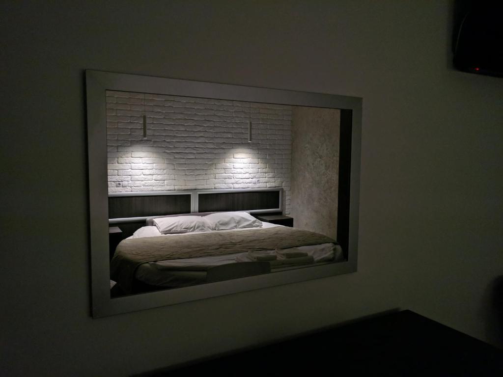 Postel nebo postele na pokoji v ubytování Art Hotel Palma
