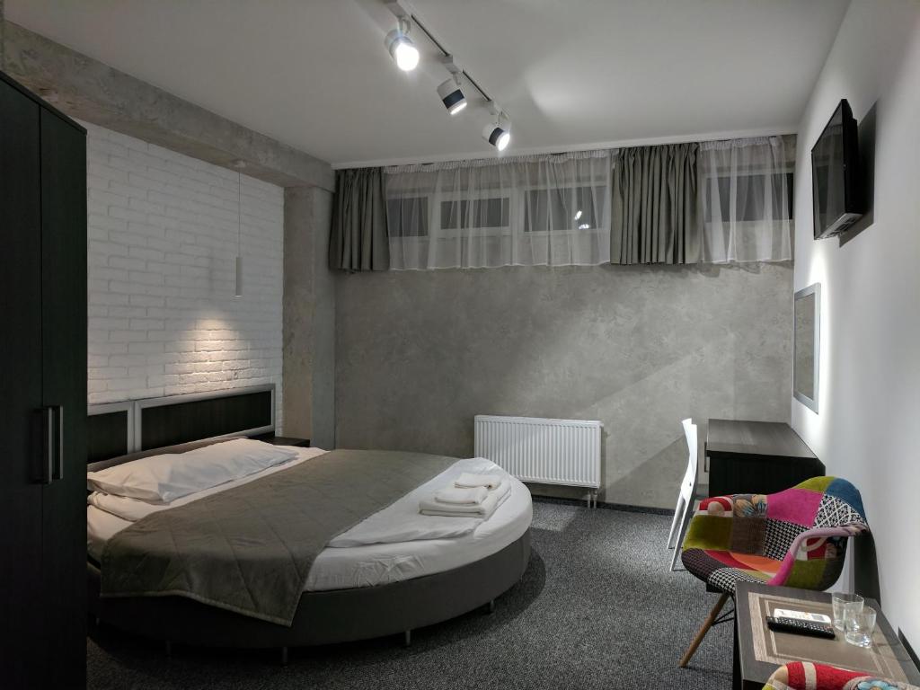 Postel nebo postele na pokoji v ubytování Art Hotel Palma