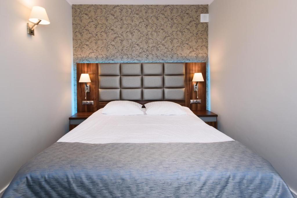 Posteľ alebo postele v izbe v ubytovaní Hotel Nowy Dwór