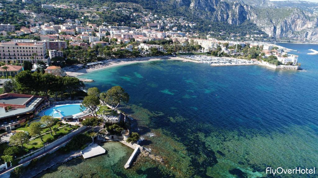 an aerial view of a beach and the ocean at Hôtel Vacances Bleues Delcloy in Saint-Jean-Cap-Ferrat