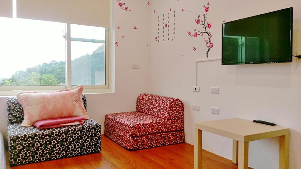 TV a/nebo společenská místnost v ubytování Fei Ying Homestay