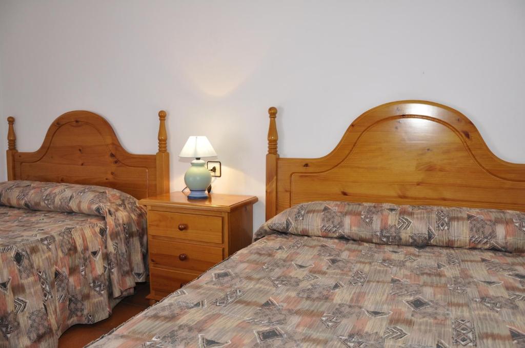 Postel nebo postele na pokoji v ubytování Hotel Castillo d'Acher