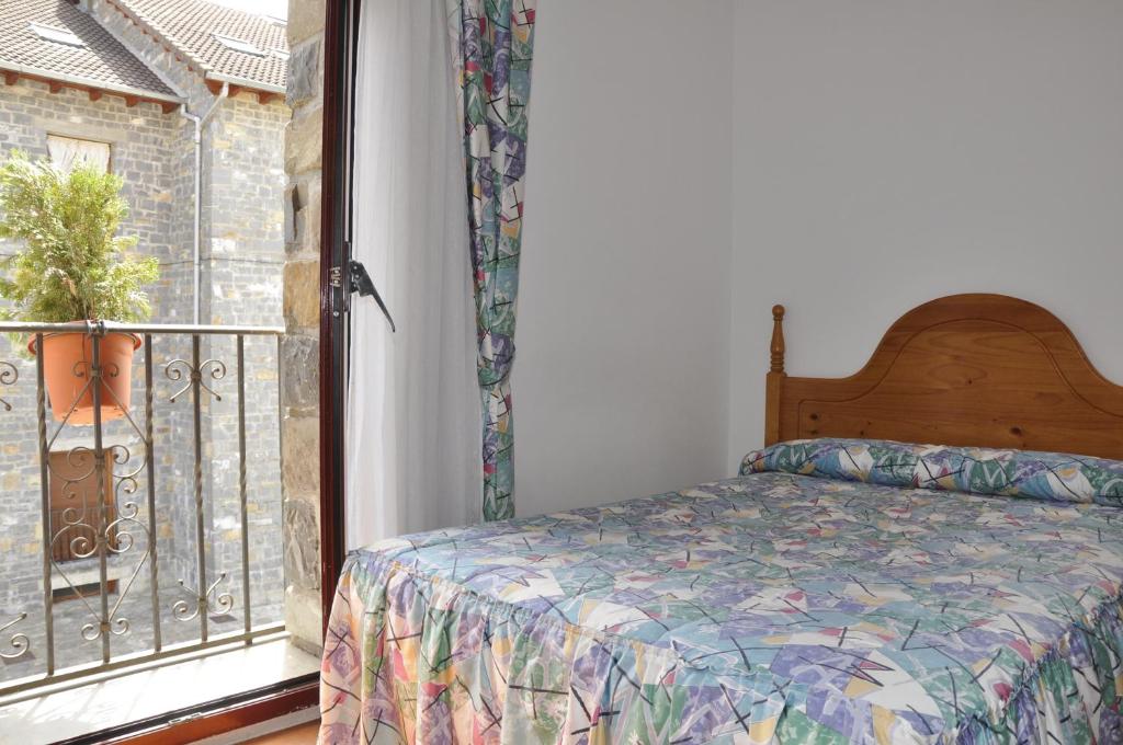 Postel nebo postele na pokoji v ubytování Hotel Castillo d'Acher