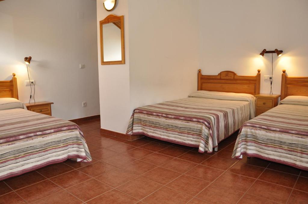 Postel nebo postele na pokoji v ubytování Hotel Castillo d'Acher