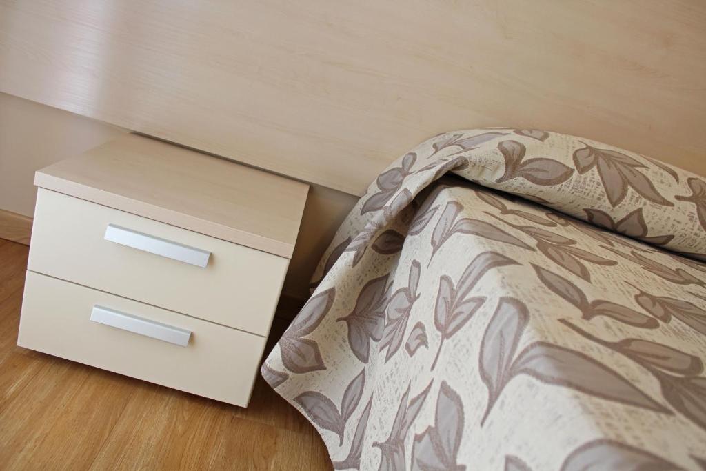 Postel nebo postele na pokoji v ubytování Hotel Silvia