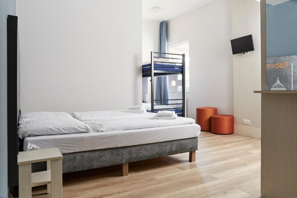 Postel nebo postele na pokoji v ubytování a&o Copenhagen Nørrebro