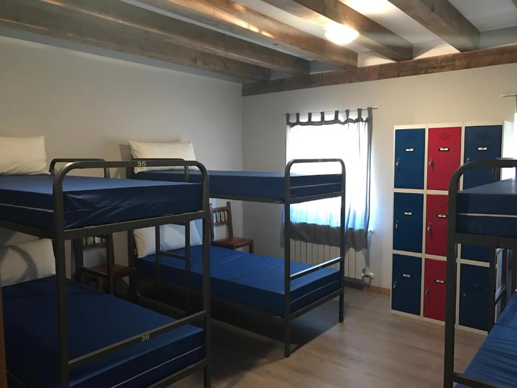 Postel nebo postele na pokoji v ubytování Albergue Orion