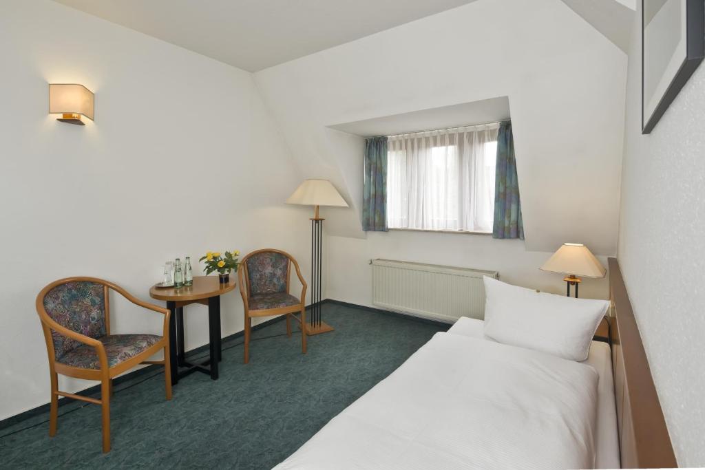 Postel nebo postele na pokoji v ubytování Hotel Katharinenhof