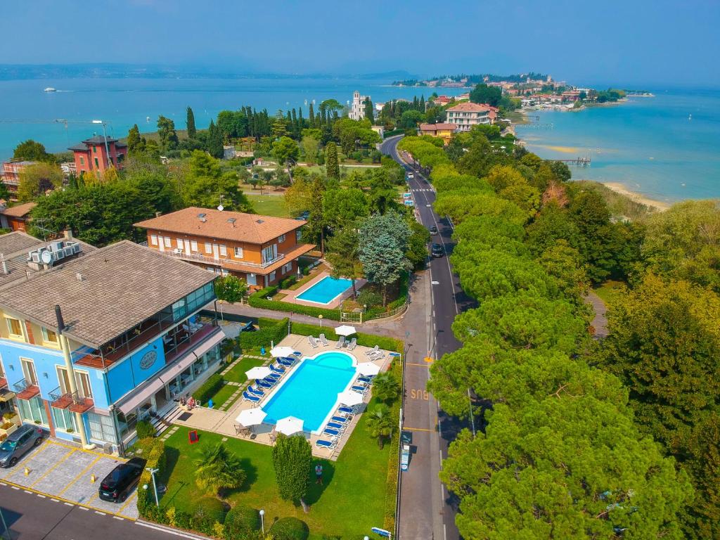 an aerial view of a house with a swimming pool at Hotel Suisse in Sirmione