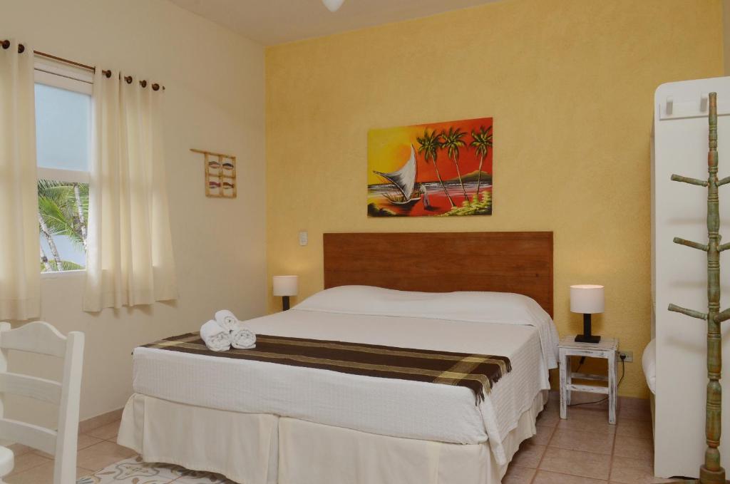 Cama ou camas em um quarto em Pousada Villa Maritima
