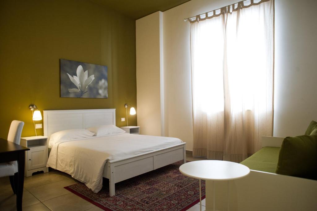 Postel nebo postele na pokoji v ubytování B&B Suite Paciotti