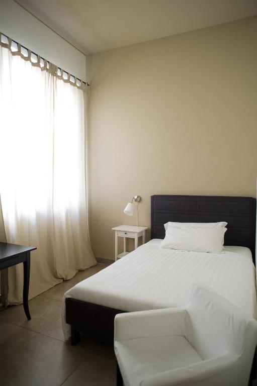Postel nebo postele na pokoji v ubytování B&B Suite Paciotti