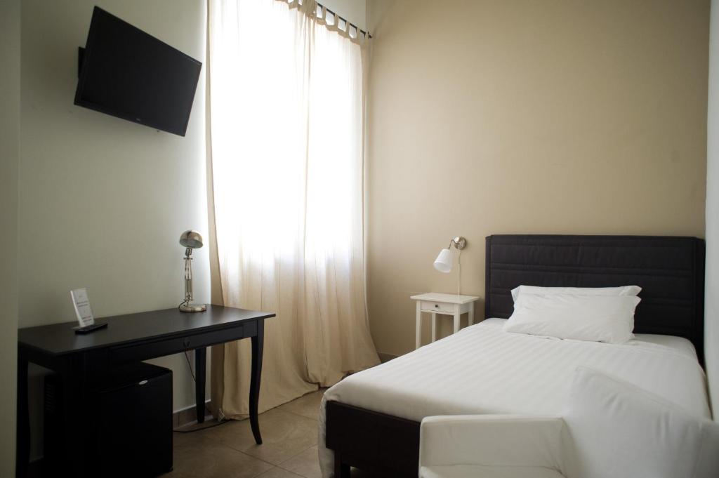 Postel nebo postele na pokoji v ubytování B&B Suite Paciotti